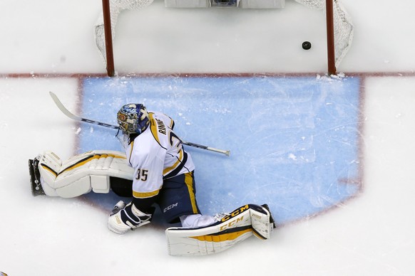 A shot by Pittsburgh Penguins&#039; Jake Guentzel settles in the goal behind Nashville Predators goalie Pekka Rinne during the third period of Game 2 of the NHL hockey Stanley Cup Final, Wednesday, Ma ...