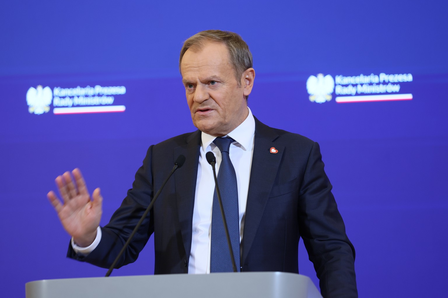 epa11045650 Polish Prime Minister Donald Tusk gestures as he speaks during a press conference after a meeting of his cabinet at the prime minister&#039;s office in Warsaw, Poland, 27 December 2023. Th ...