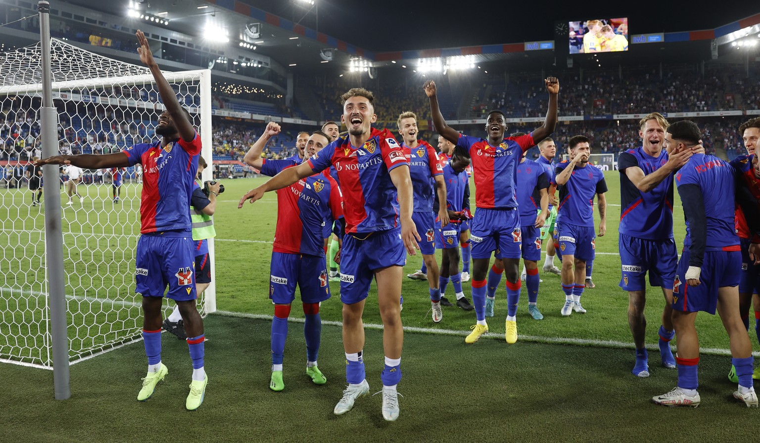Basel's Andi Zeqiri, center front, and his teammates celebrate after winning the penalty shootout during the UEFA Europa Conference League third qualifying round, second leg soccer match between FC Ba ...