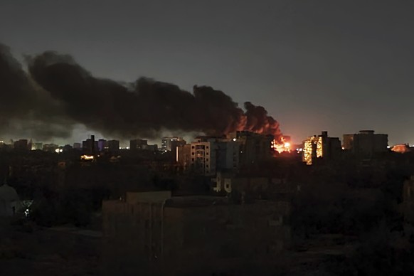 Smoke rises over the horizon as a fire burns after a strike in Khartoum, Sudan, Sunday, April 16, 2023. Washington&#039;s top diplomat said Tuesday, April 18, 2023, that a U.S. Embassy convoy came und ...