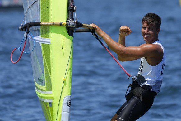 Switzerland&#039;s Mateo Sanz Lanz celebrates after winning race 2 of the men&#039;s RS:X class at the 2020 Summer Olympics, Sunday, July 25, 2021, in Fujisawa, Japan. (AP Photo/Gregorio Borgia)