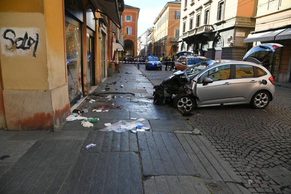 Blood is seen next to a destroyed car on a street of Modena, Italy, Saturday, May 16, 2026. (Lapresse via AP)
Italy Car Incident