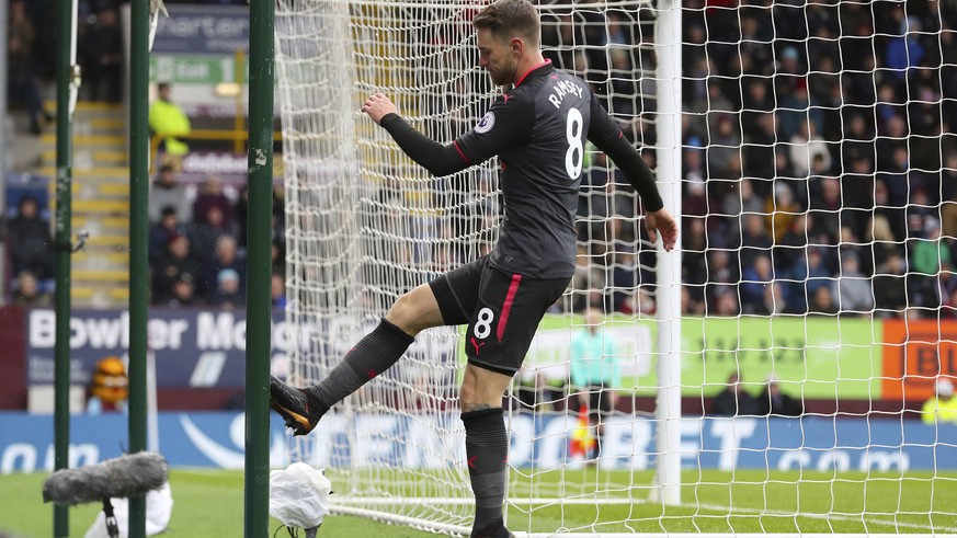Arsenal&#039;s Aaron Ramsey kicks the goalpost in frustration after missing a chance to score, during the English Premier League soccer match between Burnley and Arsenal, at Turf Moor, in Burnley, Eng ...