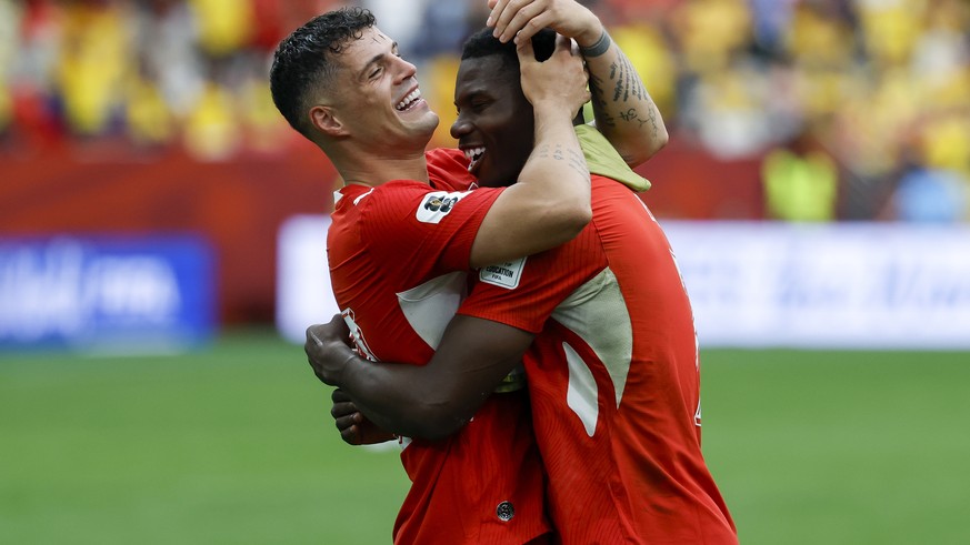 epa13096807 Switzerland's Granit Xhaka (L) and Breel Embolo celebrate winning the FIFA World Cup 2026 Round of 16 match Switzerland against Colombia, in Vancouver, Canada, 07 July 2026. EPA/PETER ...