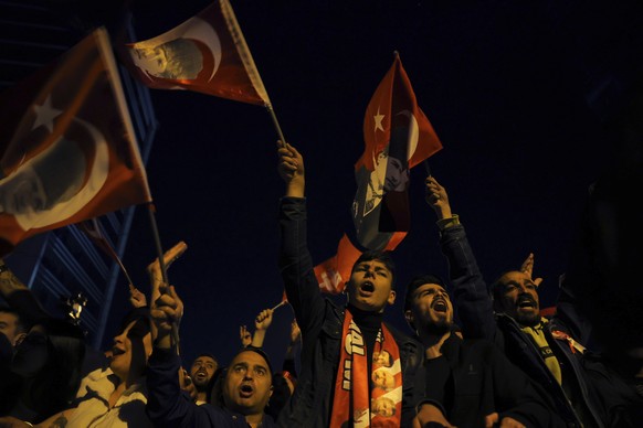 Supporters of Republican People's Party shout slogans outside the headquarters of CHP, in Ankara, Turkey, Sunday, May 14, 2023. More than 64 million people, including 3.4 million overseas voters, ...