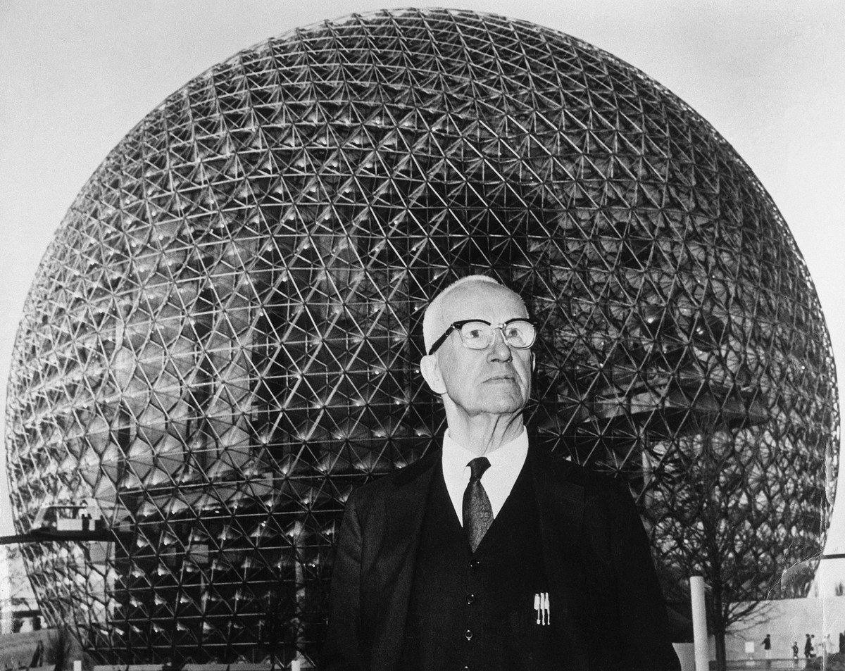 The architect stands in front of his creation, a geodesic dome which acts as the US pavilion at the 1967 World's Fair