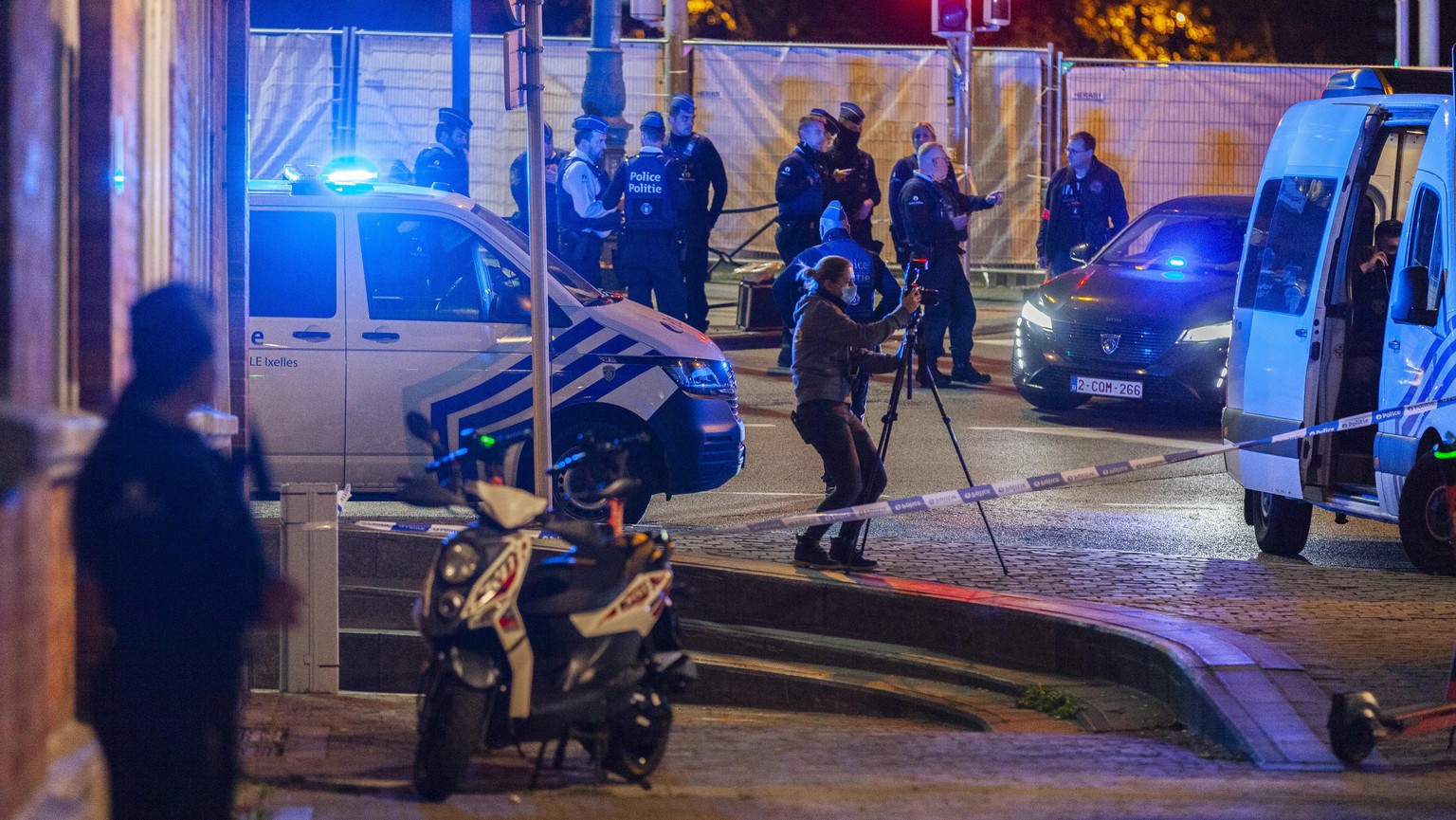 Police and inspectors work in an area where a shooting took place in the center of Brussels, Monday, Oct. 16, 2023. Belgian police say that two people are dead in central Brussels after several shots  ...