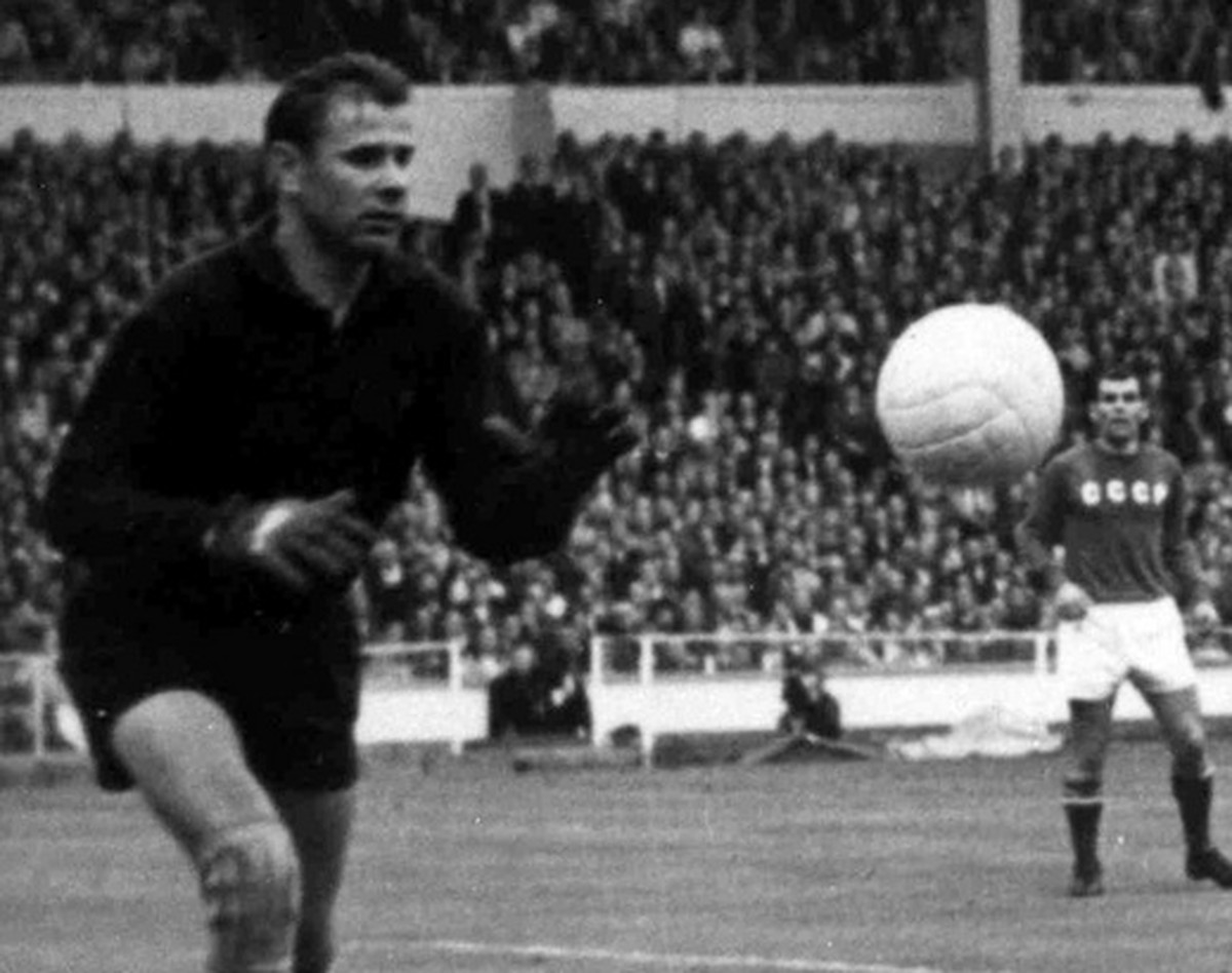 FILE - In this July 29, 1966, file photo, Portugal's Eusebio, in light shirt, forces his way past two defenders only to see his shot saved by Russian goalkeeper Lev Yashin during the Football Wor ...