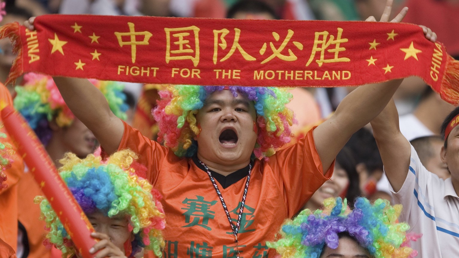 FILE - In this Sept. 23, 2007, file photo, Chinese fans cheer during the quarterfinal match between Norway and China for the FIFA Women&#039;s World Cup soccer tournament held at the Wuhan Sports Cent ...