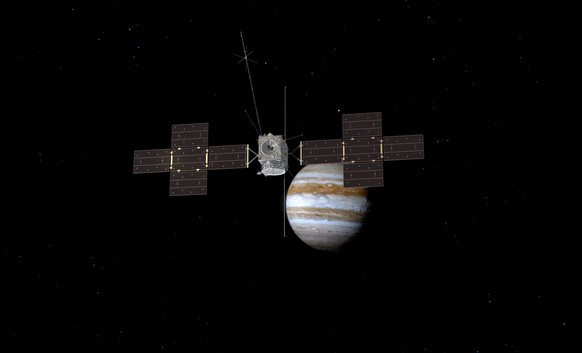 This image provided by the European Space Agency depicts the Jupiter Icy Moons Explorer, Juice, spacecraft orbiting the gas giant. (ESA/ATG Medialab via AP)