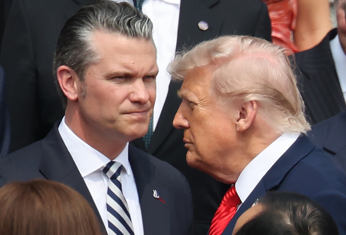epa12955752 US President Donald Trump (R) and US Defense Secretary Pete Hegseth attend a welcome ceremony at the Great Hall of the People in Beijing, China, 14 May 2026. US President Trump is in Beiji ...
