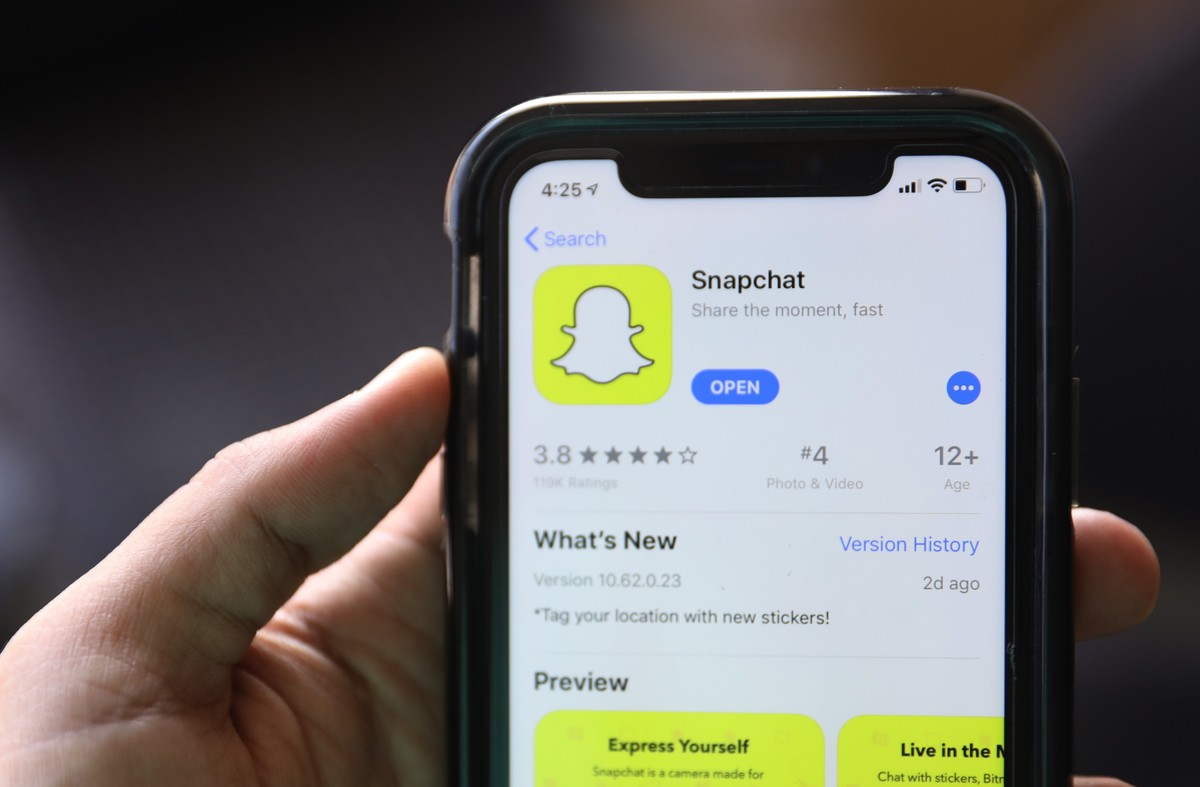 FILE - This July 30, 2019, file photo shows an introduction page for Snapchat shown in a mobile phone displayed at Apple's App Store in Chicago. Snapchat says it will stop