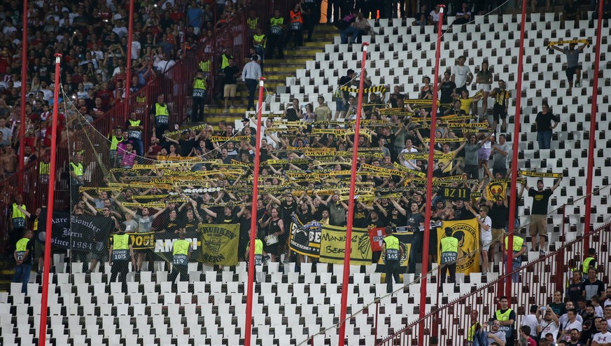 Fans from the visiting team YB cheer for their team, during the UEFA Champions League playoff match between Serbia&#039;s FK Red Star Belgrade and Switzerland&#039;s BSC Young Boys, on Tuesday, August ...