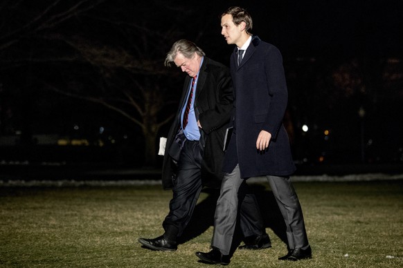 FILE - In this March 15, 2017, file photo, White House Senior Advisers Jared Kushner, right, and Steve Bannon, left, walk on the South Lawn of the White House in Washington, after traveling to Detroit ...