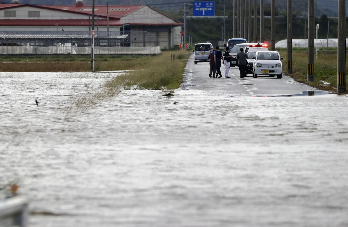 A road is submerged under water in Saito, Miyazaki Prefecture, Japan Monday, Sept. 19, 2022. Typhoon Nanmadol slammed southwestern Japan with rainfall and winds Monday as it swerved north toward Tokyo ...