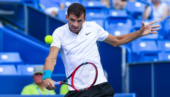 epa05496240 Grigor Dimitrov of Bulgaria in action against Stan Wawrinka of Switzerland during their 3rd round match at the Western &amp; Southern Open Tennis Championships at the Linder Family Tennis  ...