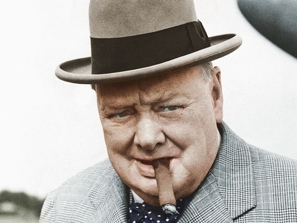 British statesman Winston Churchill in 1949, smoking one of his beloved cigars as he leaves the plane that brought him back from a continental holiday. He caught cold while swimming on the Riviera, bu ...