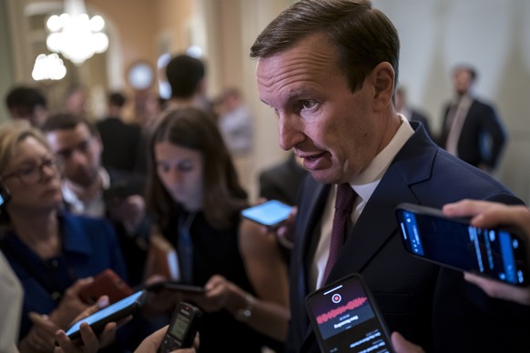 Sen. Chris Murphy, D-Conn., speaks to reporters outside the chamber to answer questions about his efforts to reach a bipartisan Senate agreement to rein in gun violence, at the Capitol in Washington,  ...