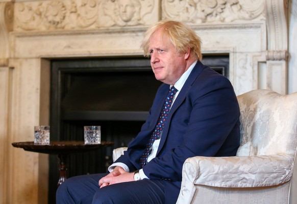 epa09391398 British Prime Minister Boris Johnson during his meeting with opposition leader of Belarus Svetlana Tikhanovskaya (not pictured), in London, Britain, 03 August 2021. Svetlana Tikhanovskaya, ...