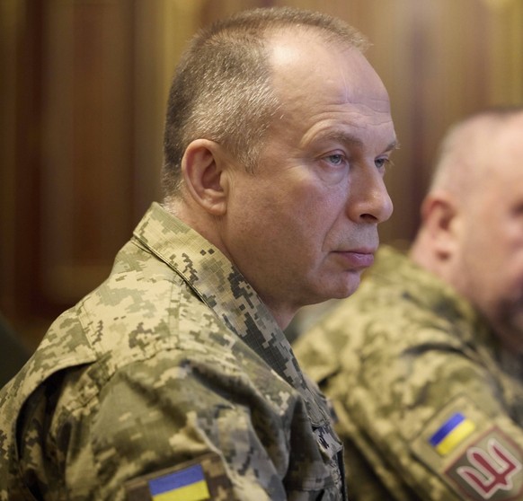 February 10, 2024, Kiev, Ukraine: Ukrainian Commander of the Ukraine Armed Forces Oleksandr Syrskyi, left, listens to President Volodymyr Zelenskyy during a meeting with his new military leadership te ...