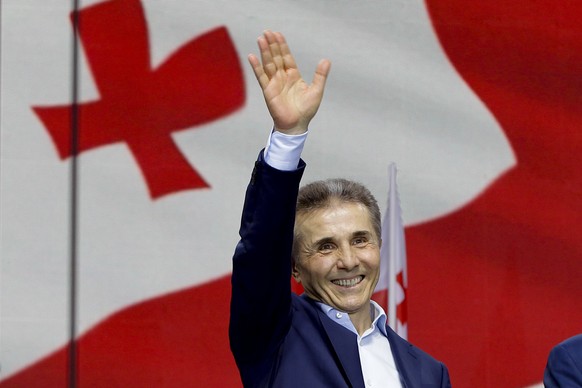 Billionaire Bidzina Ivanishvili, leader of the created by him the Georgian Dream party greets demonstrators during a rally in support of &quot;Russian law&quot; in Tbilisi, Georgia, on Monday, April 2 ...