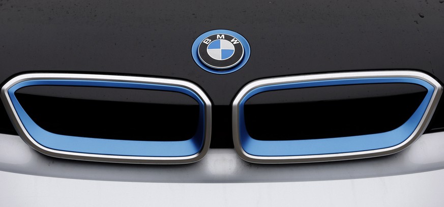 FILE - In this Jan. 20, 2015 file photo the logo of german car manufacturer BMW is pictured on a BMW i3 electric drive car at the production line in Dingolfing, Germany. BMW AG says Thursday, March 12 ...