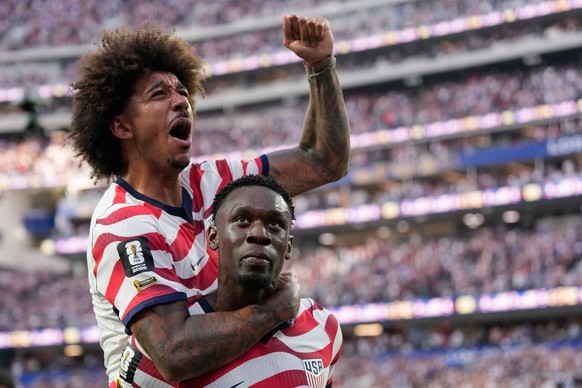 United States' Folarin Balogun, below, celebrates scoring his side's third goal against Paraguay with teamate Chris Richards during the World Cup Group D soccer match in Inglewood, Calif., n ...