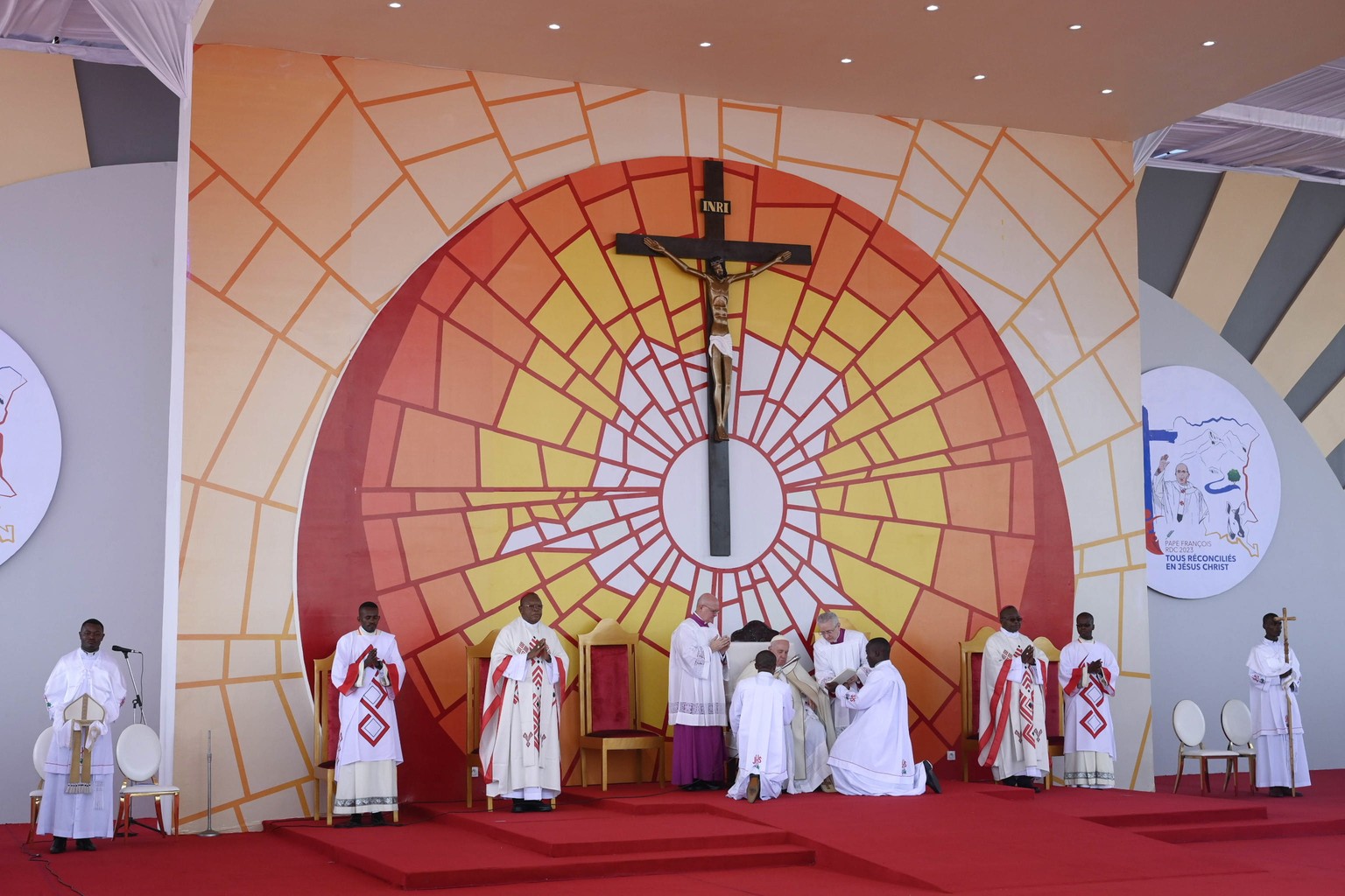 epa10442409 A handout picture provided by the Vatican Media shows Pope Francis (C, background) holding a mass at Ndolo Airport in Kinshasa on the second day of the Pontiff&#039;s apostolic visit to th ...