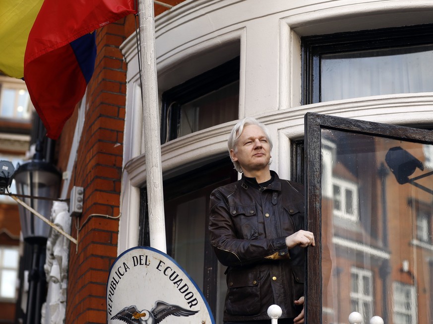 FILE- In this Friday May 19, 2017 file photo, WikiLeaks founder Julian Assange greets supporters outside the Ecuadorian embassy in London. Ecuador&#039;s President Lenin Moreno said on Tuesday, March  ...