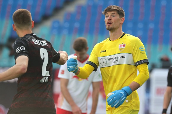 epa09158645 Stuttgart players Waldemar Anton (L) and goalkeeper Gregor Kobel (R) react during the German Bundesliga soccer match between RB Leipzig and VfB Stuttgart in Leipzig, Germany, 25 April 2021 ...