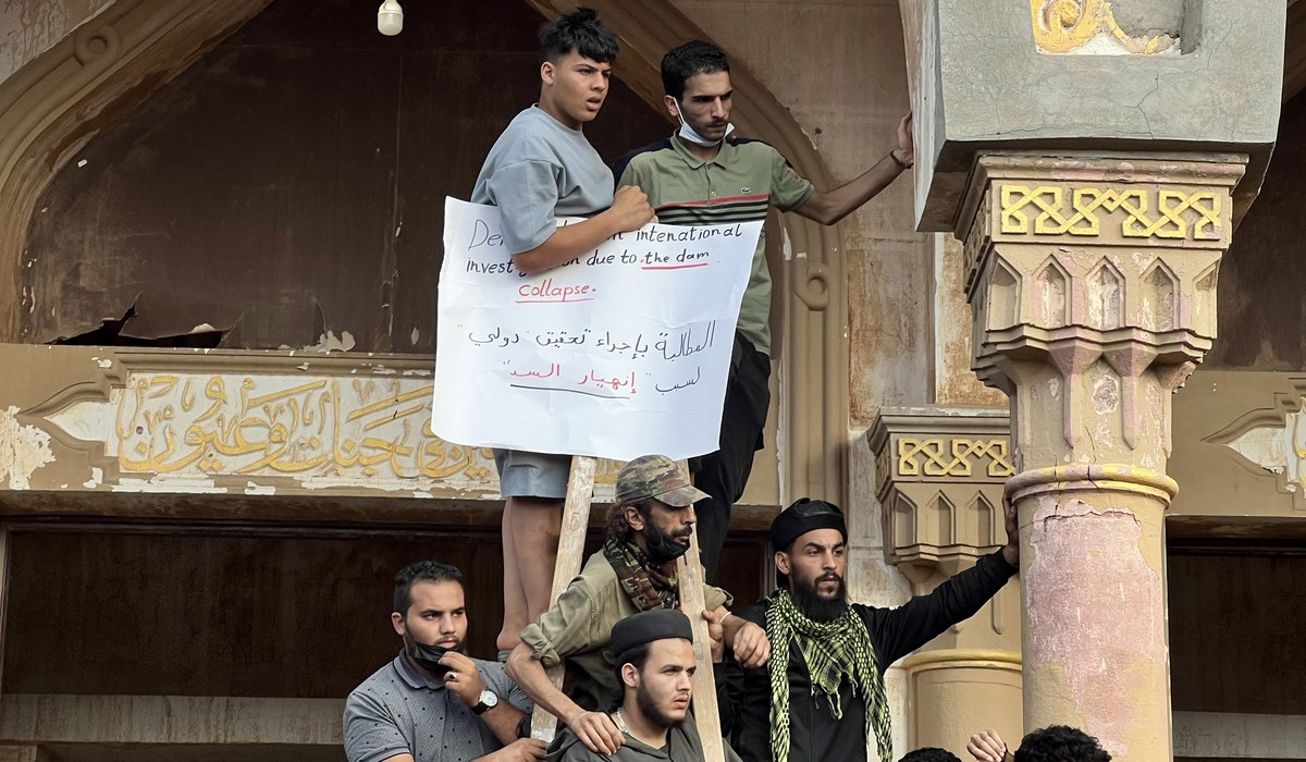 epa10868425 People who survived the deadly storm that hit Libya, protest against the government outside the Al Sahaba Mosque in Derna, Libya, 18 September 2023. Intense rainfall from the storm in the  ...