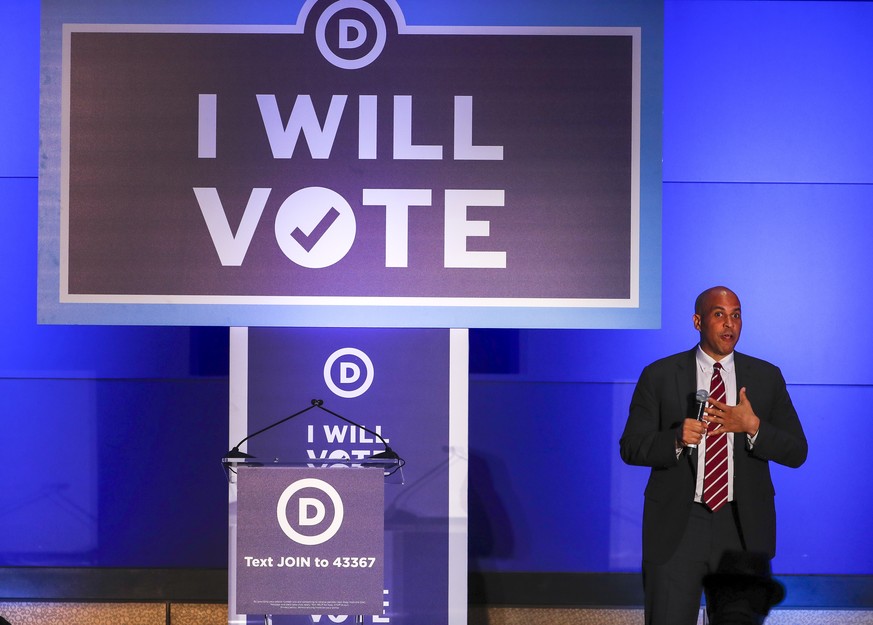 epa06899495 Senator Cory Booker of New Jersey speaks during the 'I Will Vote' Gala fundraising event sponsored by the Democratic National Committee at the Georgia Aquarium in Atlanta, Georgi ...
