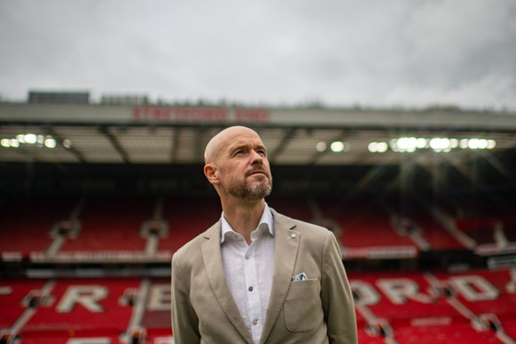 epa09969735 A handout photo made available by English Premier League club Manchester United of the new Manchester United manager, Erik ten Hag, during a press conference at Old Trafford, Manchester, B ...