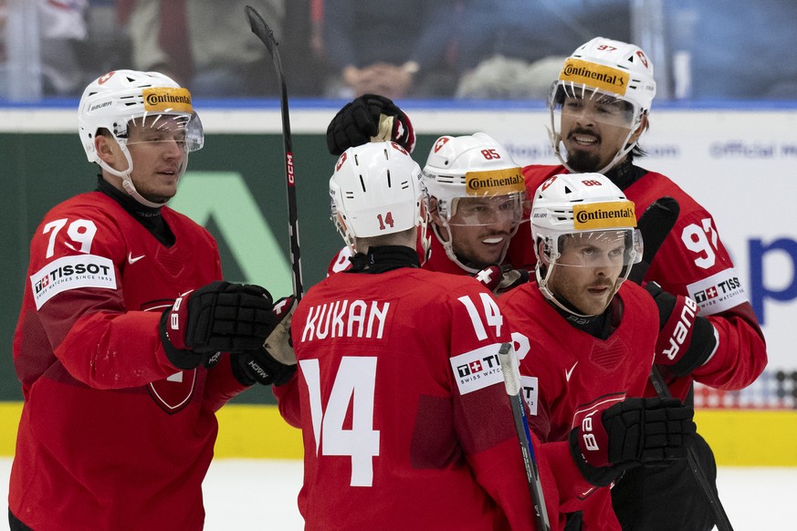 Switzerland&#039;s Calvin Thuerkauf, Dean Kukan, Sven Andrighetto, Christoph Bertschy and Jonas Siegenthaler, from left, celebrate their goal to 3-1 during the Ice Hockey World Championship quarter fi ...