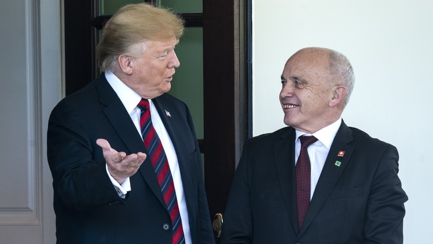 epa07576060 US President Donald J. Trump (L) greets the president of the Swiss Confederation, Ueli Maurer (R), outside the West Wing of the White House in Washington, DC, USA, 16 May 2019. The two are ...