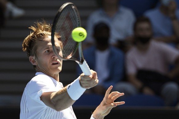 Sebastian Korda of the U.S. plays a forehand return to Cameron Norrie of Britain during their first round match at the Australian Open tennis championships in Melbourne, Australia, Monday, Jan. 17, 2022. (AP Photo/Andrew Brownbill)
Sebastian Korda