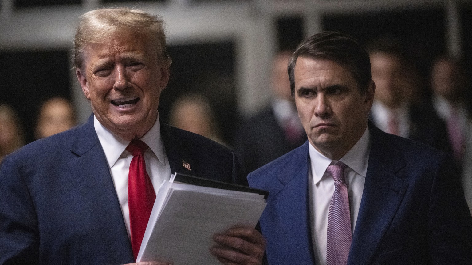 Former President Donald Trump addresses the media, alongside his attorney, Todd Blanche, right, at the end of the day of a court session for his trial at Manhattan criminal court, Thursday, May 16, 20 ...