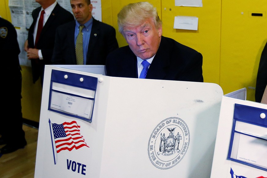 Republican presidential nominee Donald Trump votes at PS 59 in New York, New York, U.S. November 8, 2016. REUTERS/Carlo Allegri