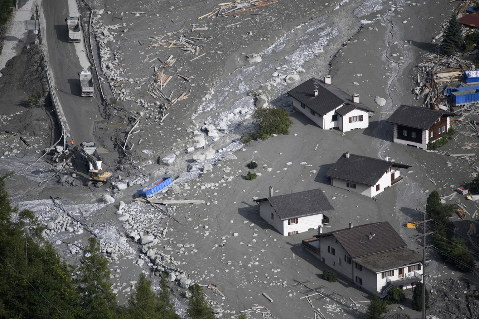 Search and rescue teams arrive, in the village Bondo in Graubuenden in South Switzerland, on Thursday, August 24, 2017. The village had been hit by a massive landslide yesterday. The main road between ...
