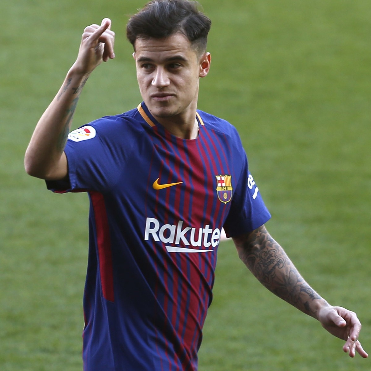 Barcelona's new signing Brazilian Philippe Coutinho poses for the media, during his official presentation at the Camp Nou stadium in Barcelona, Spain, Monday, Jan. 8, 2018. Coutinho is joining Ba ...