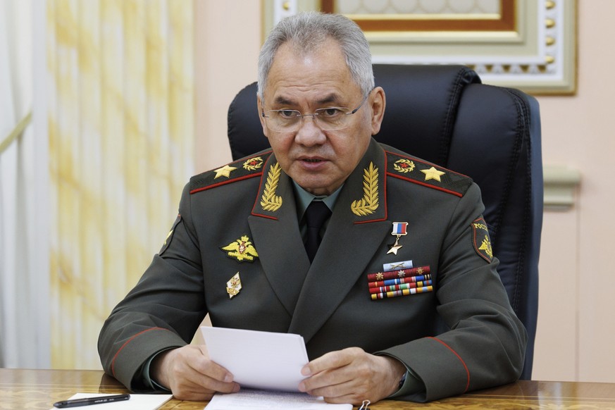 In this photo released by the Russian Defense Ministry Press Service on Friday, April 26, 2024, Russian Defense Minister Sergei Shoigu speaks to Minister of National Defense of the People&#039;s Repub ...