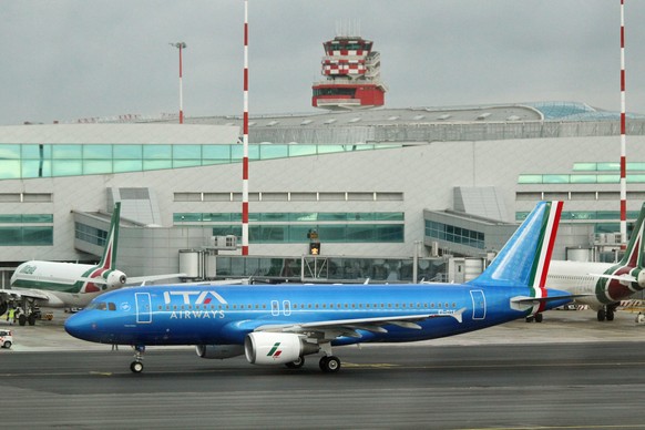 epa09655921 A view of the first ITA Airways aircraft with the new blue livery prior to take-off from Rome Fiumicino airport to Milan, Italy, 24 December 2021. ITA Airways flight AZ 2044 is operated wi ...