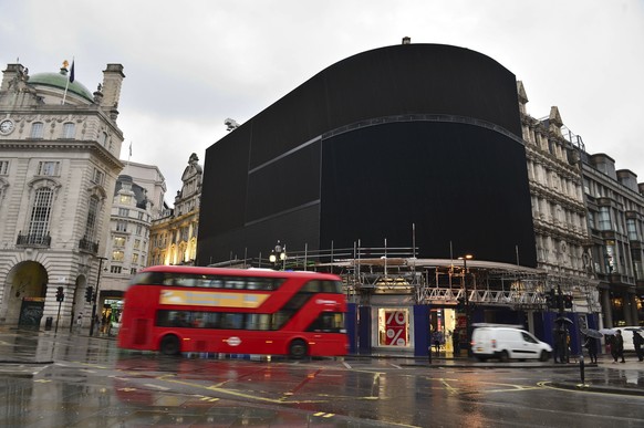 The advertising screens at Piccadilly Circus, central London, after they were switched off in preparation for redevelopment Monday Jan. 16, 2017. The iconic lights have gone out so that the electronic ...