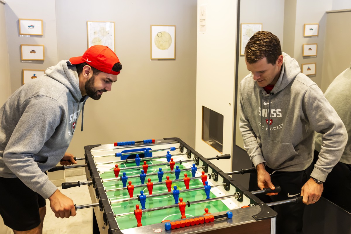 Switzerland's goaltenders Stephane Charlin, left, and Leonardo Genoni, right, play table soccer (foosball), during the media opportunity of the Switzerland National Ice Hockey Team at the IIHF 20 ...