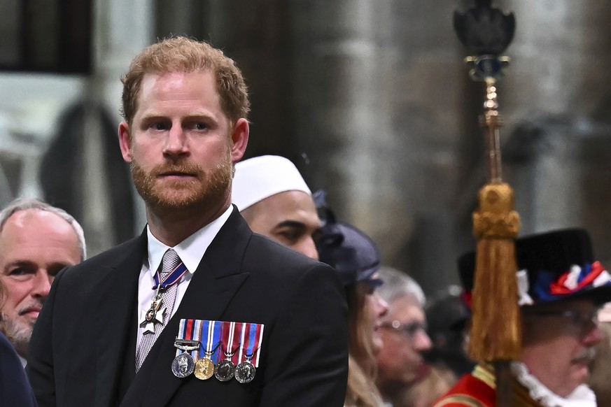 FILE -Britain&#039;s Prince Harry, Duke of Sussex looks on as Britain&#039;s King Charles III leaves Westminster Abbey after coronation in central London Saturday, May 6, 2023. (Ben Stansall/Pool phot ...