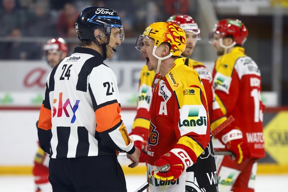 Biel PostFinance top scorer Tony Rajala, right, reprimands referee Danijel Pechacek in the National League ice hockey championship game between EHC Biel and Luzanne HC, on Saturday,…