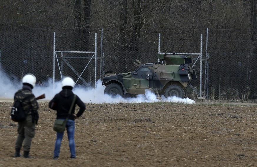 Greek army operate as migrants try to enter Greece from Turkey at the Greek-Turkish border in Kastanies on Wednesday, March 4, 2020. Facing a potential wave of nearly a million people fleeing fighting ...