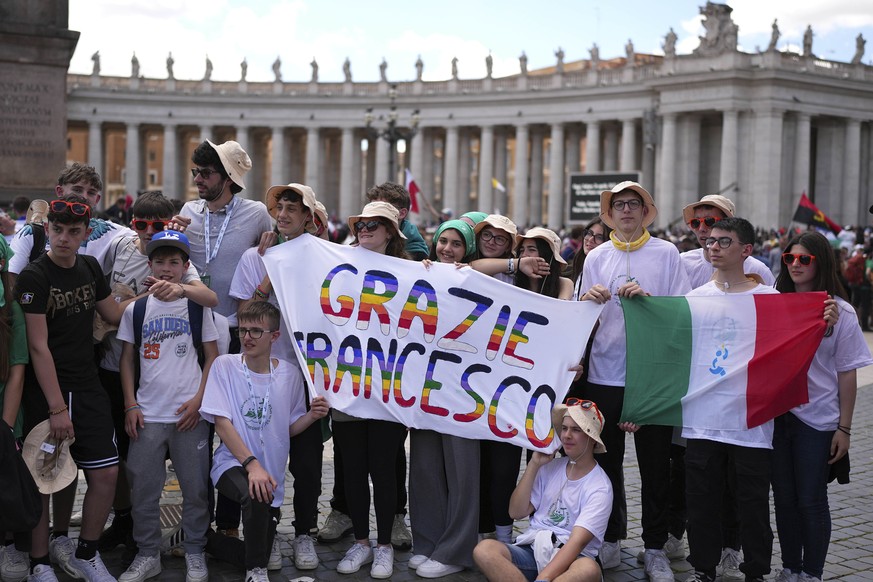 Youngsters hold a banner during the funeral of Pope Francis in St. Peter&#039;s Square at the Vatican, Saturday, April 26, 2025. (AP Photo/Andreea Alexandru)
Vatican Pope