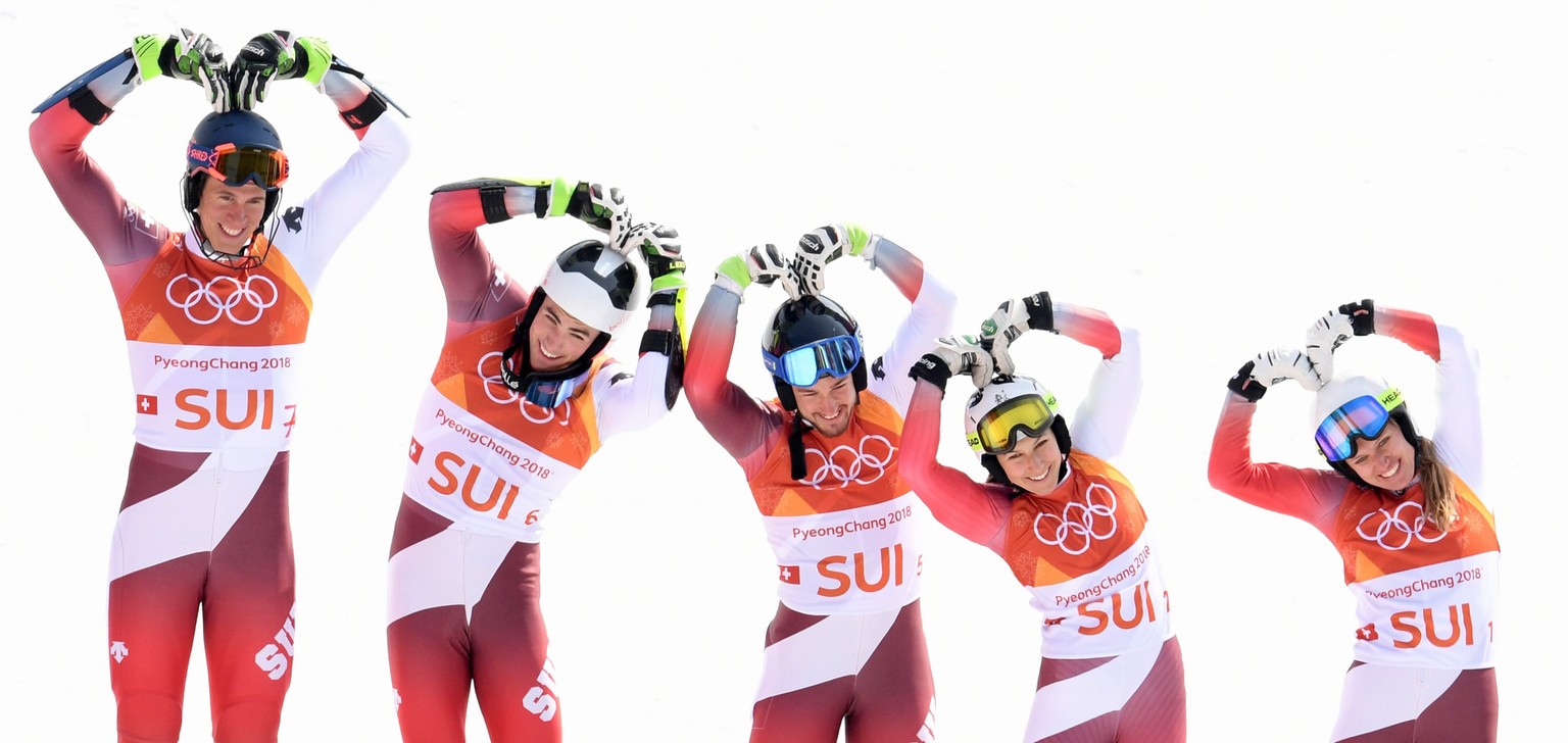 epa06559547 Gold medal winning team of Switzerland celebrates during the venue ceremony for the Alpine Team Event race at the Yongpyong Alpine Centre during the PyeongChang 2018 Olympic Games, South K ...