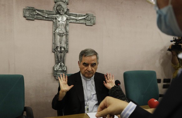 FILE - In this Sept. 25, 2020 Cardinal Angelo Becciu talks to journalists during a press conference in Rome. Italy